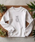 The cat is woven with threads, machine embroidery design